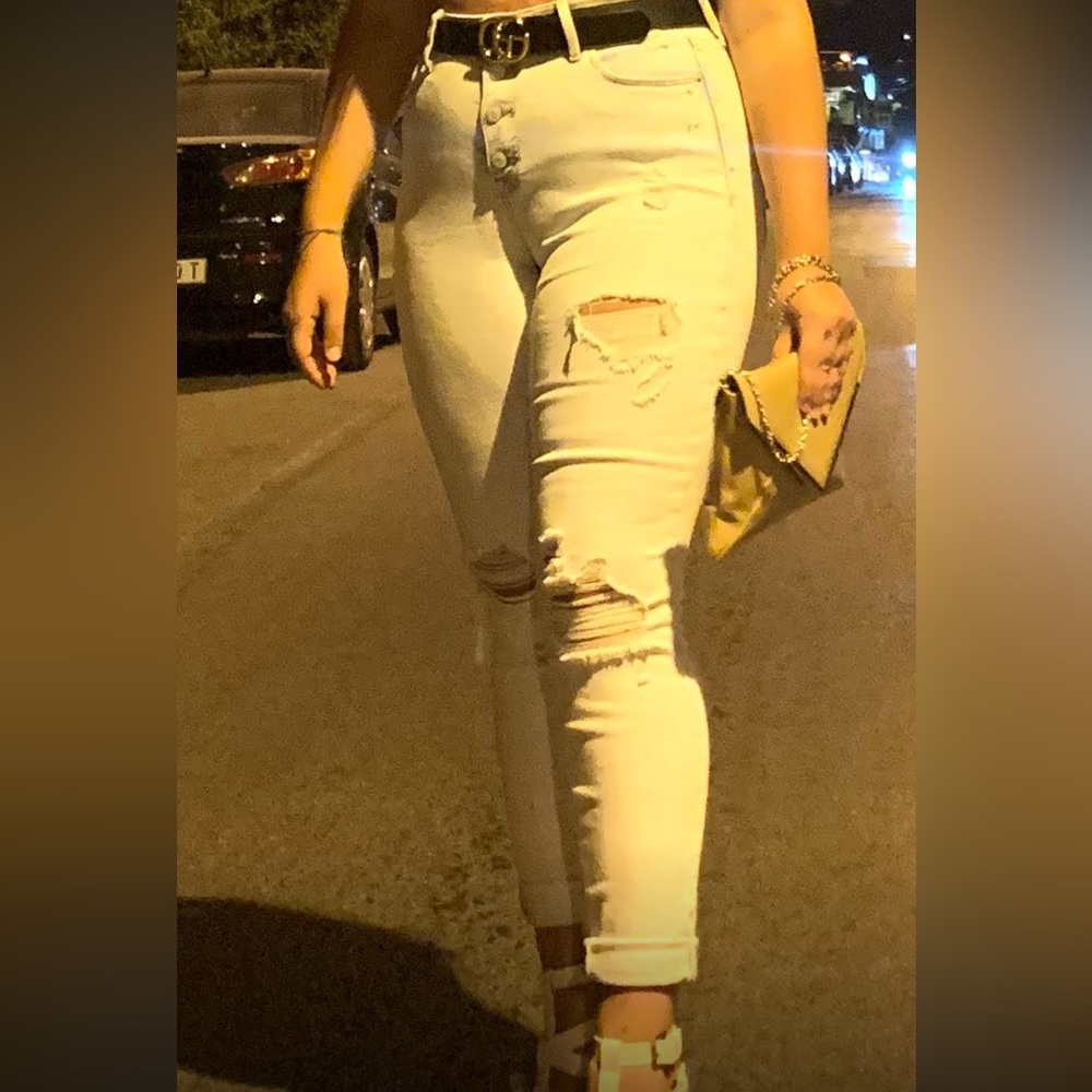 Light wash skinny jeans with buttons